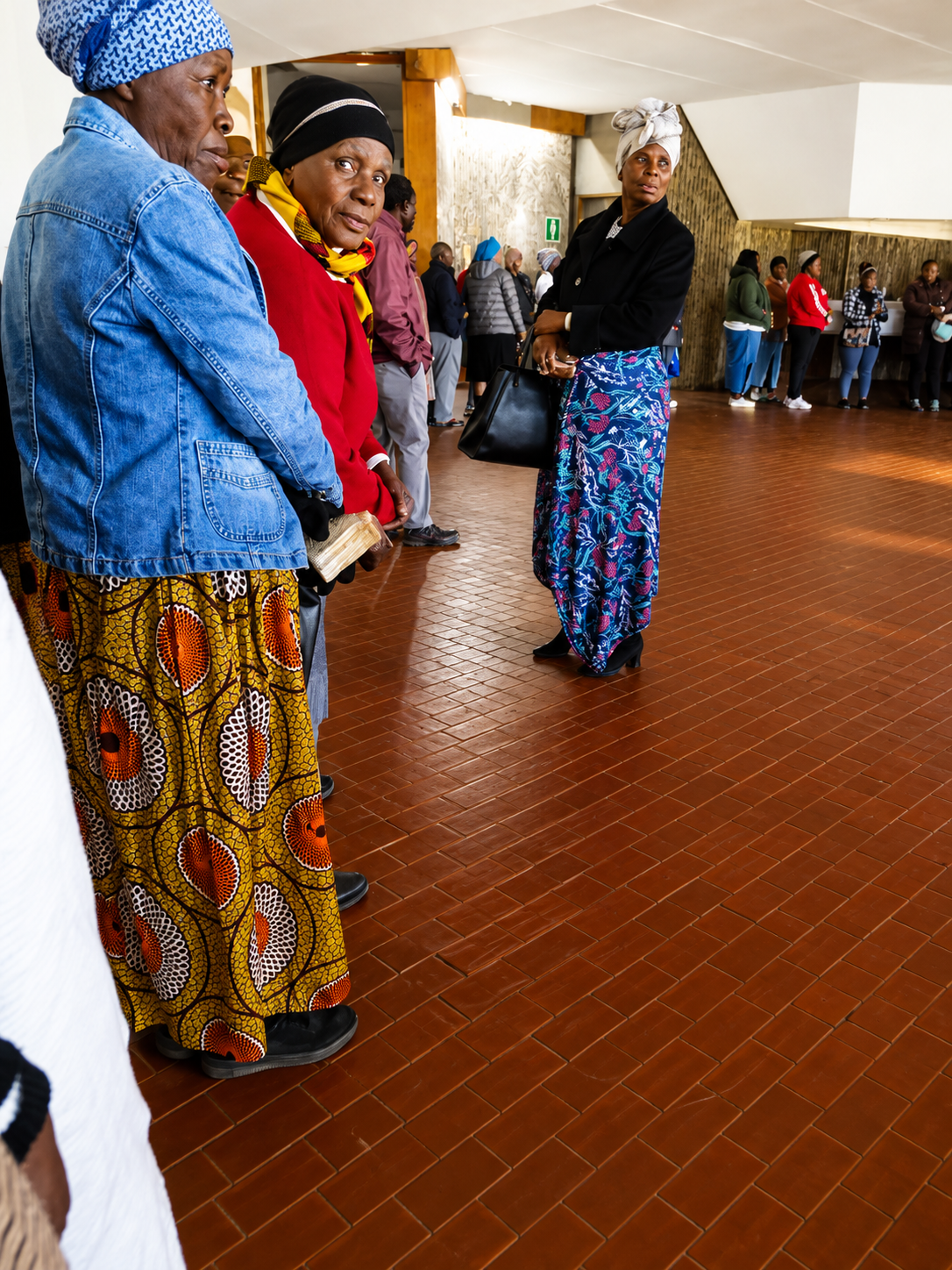 Club members gathering together in the community hall